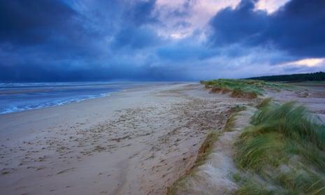 A stormy winter morning at Holkham Bay beach on the North Norfolk Coast.