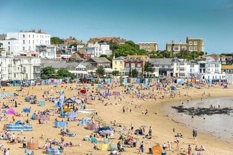 Holidaymakers on the beach at Viking Bay in Broadstairs, Kent